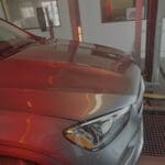Car in automated car wash station.